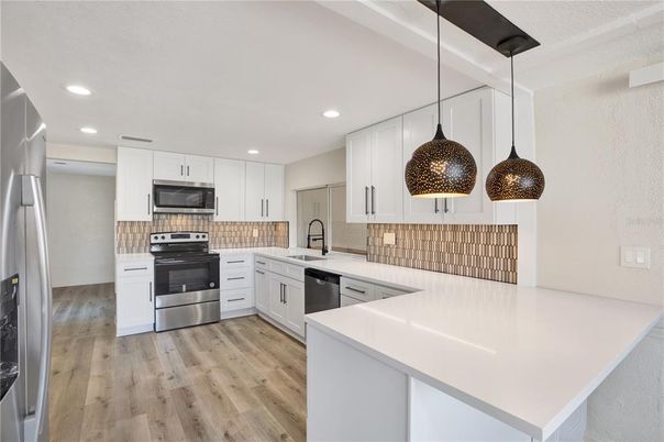 Interior, Kitchen, Pendant Lights, Recessed Lighting, Stainless Steel Appliances, Wood Texture Flooring