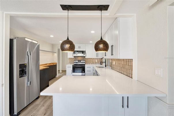 Interior, Kitchen, Pendant Lights, Recessed Lighting, Stainless Steel Appliances, Wood Texture Flooring