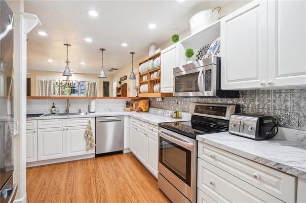 Interior, Kitchen, Pendant Lights, Recessed Lighting, Stainless Steel Appliances, Wood Texture Flooring