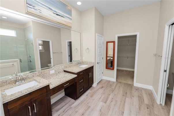Bathroom, Dual Sink Vanities, Interior, Recessed Lighting, Wood Texture Flooring