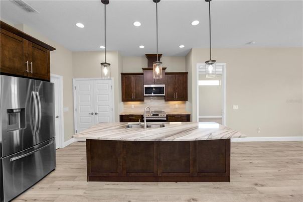 Interior, Kitchen, Pendant Lights, Recessed Lighting, Stainless Steel Appliances, Wood Texture Flooring