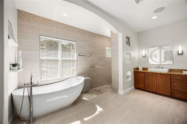 Bathroom, Dual Sink Vanities, Free Standing Baths, Glass Shower, Interior, Recessed Lighting, Wood Texture Flooring