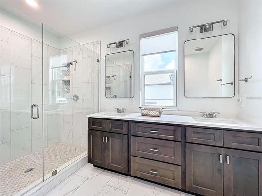 Bathroom, Dual Sink Vanities, Glass Shower, Interior, Marble, Marble Walls, Recessed Lighting
