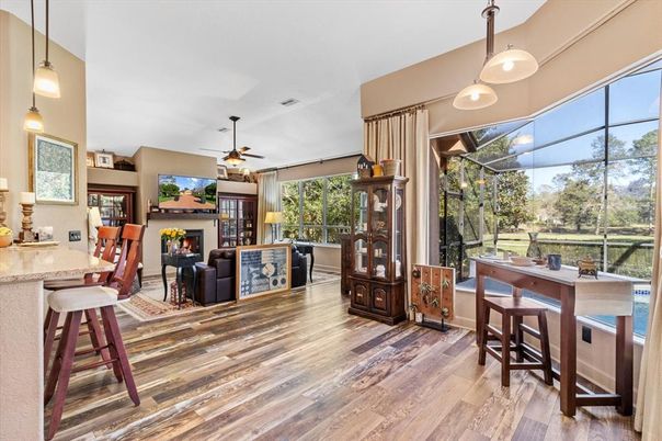 Dining room, Fireplace, Interior, Living room, Pendant Lights, Sun Room, Wood Texture Flooring