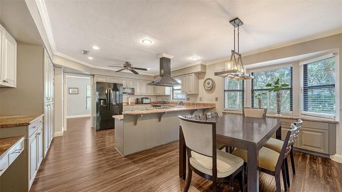 Dining room, Interior, Kitchen, Pendant Lights, Recessed Lighting, Stainless Steel Appliances, Wood Texture Flooring