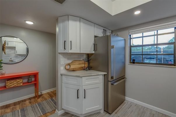 Interior, Kitchen, Recessed Lighting, Washer, Wood Texture Flooring