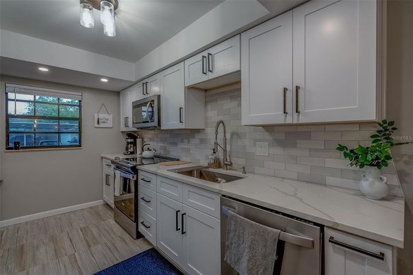 Interior, Kitchen, Recessed Lighting, Stainless Steel Appliances, Wood Texture Flooring