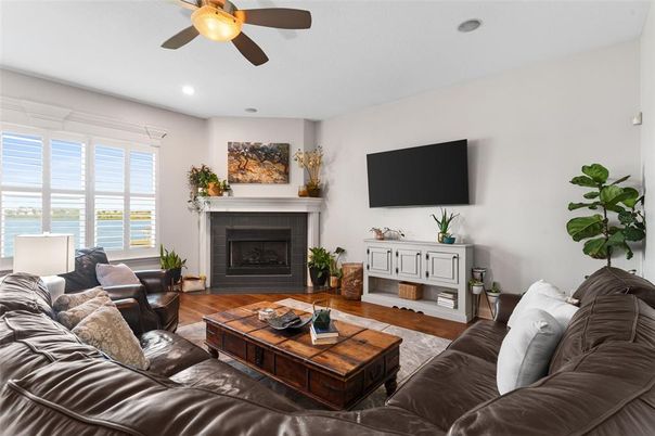 Fireplace, Interior, Living room, Recessed Lighting, Water, Wood Texture Flooring