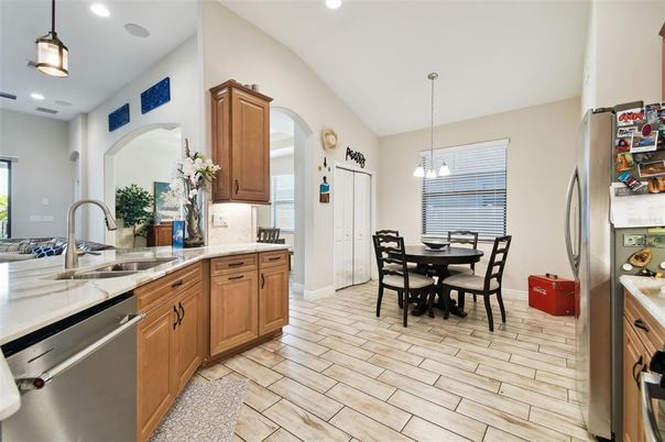 Dining room, Interior, Kitchen, Pendant Lights, Recessed Lighting, Stainless Steel Appliances, Wood Texture Flooring