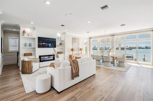 Dining room, Fireplace, Interior, Living room, Pendant Lights, Recessed Lighting, Water, Wood Texture Flooring