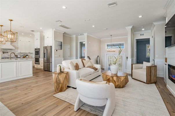 Fireplace, Interior, Kitchen, Living room, Pendant Lights, Recessed Lighting, Stainless Steel Appliances, Wood Texture Flooring