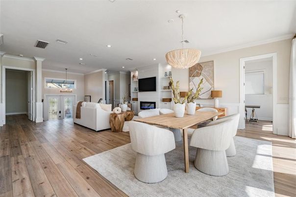 Chandelier, Dining room, Fireplace, Interior, Living room, Pendant Lights, Recessed Lighting, Wood Texture Flooring
