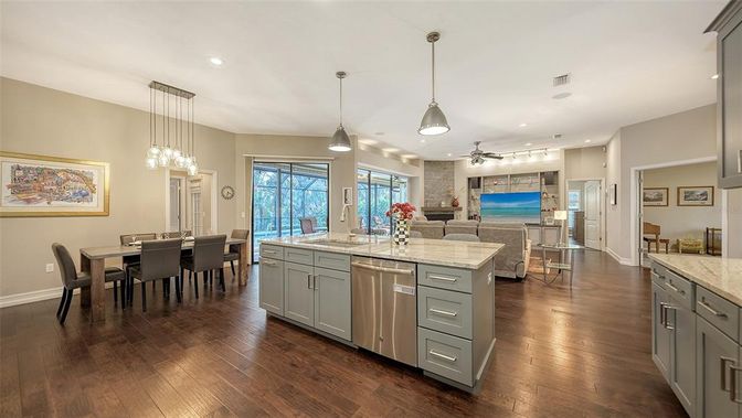 Dining room, Interior, Kitchen, Living room, Pendant Lights, Recessed Lighting, Stainless Steel Appliances, Wood Texture Flooring