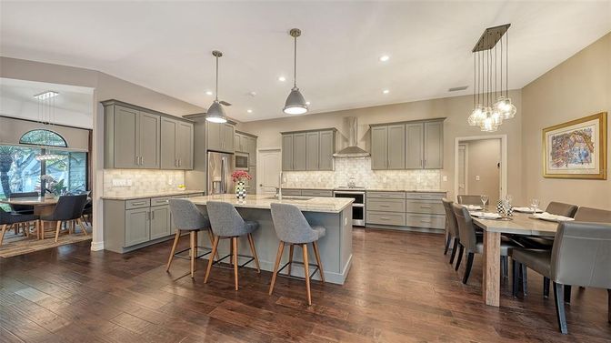 Dining room, Interior, Kitchen, Pendant Lights, Recessed Lighting, Stainless Steel Appliances, Wood Texture Flooring