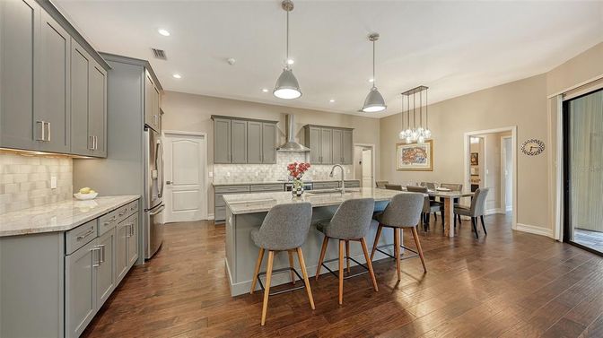 Dining room, Interior, Kitchen, Pendant Lights, Recessed Lighting, Stainless Steel Appliances, Wood Texture Flooring