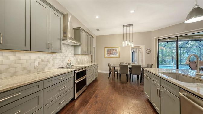 Dining room, Interior, Kitchen, Pendant Lights, Recessed Lighting, Stainless Steel Appliances, Wood Texture Flooring