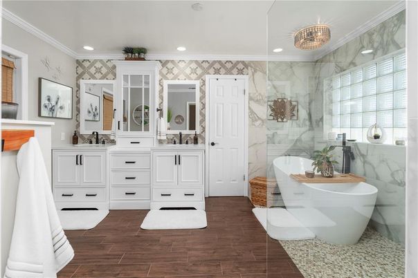 Bathroom, Dual Sink Vanities, Free Standing Baths, Glass Shower, Interior, Marble Walls, Recessed Lighting, Wood Texture Flooring