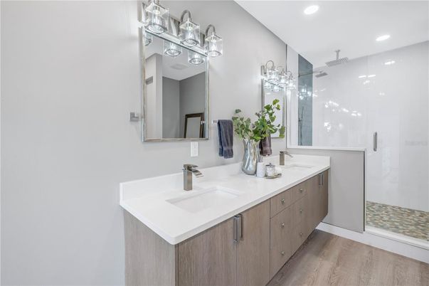 Bathroom, Dual Sink Vanities, Glass Shower, Interior, Recessed Lighting, Wood Texture Flooring