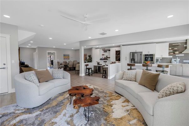 Dining room, Interior, Kitchen, Living room, Recessed Lighting, Stainless Steel Appliances, Wood Texture Flooring