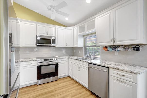 Interior, Kitchen, Recessed Lighting, Stainless Steel Appliances, Wood Texture Flooring