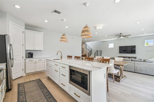 Dining room, Interior, Kitchen, Living room, Pendant Lights, Recessed Lighting, Stainless Steel Appliances, Wood Texture Flooring