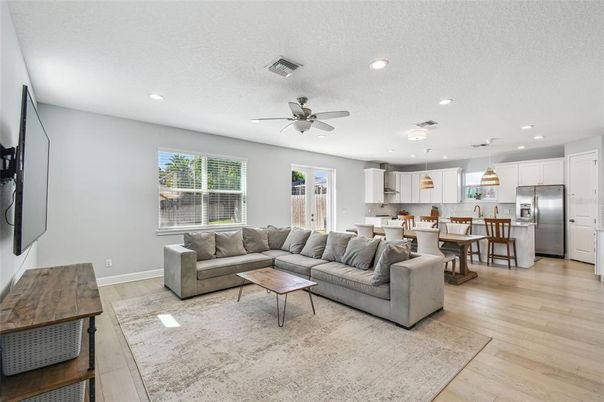Dining room, Interior, Kitchen, Living room, Pendant Lights, Recessed Lighting, Stainless Steel Appliances, Wood Texture Flooring