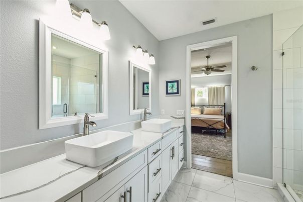 Bathroom, Bedroom, Dual Sink Vanities, Glass Shower, Interior, Marble, Wood Texture Flooring