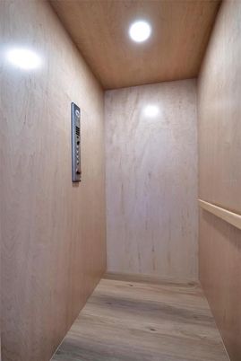 Elevator, Interior, Recessed Lighting, Wooden Ceilings, Wood Texture Flooring, Wooden Walls