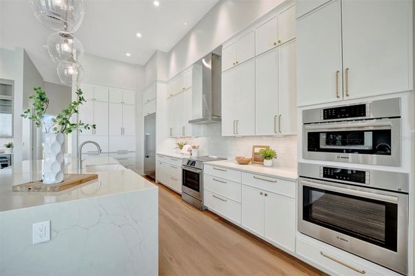 Interior, Kitchen, Recessed Lighting, Stainless Steel Appliances, Wood Texture Flooring