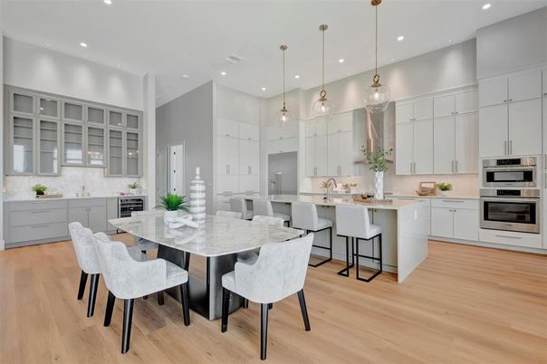 Dining room, Interior, Kitchen, Pendant Lights, Recessed Lighting, Stainless Steel Appliances, Wood Texture Flooring