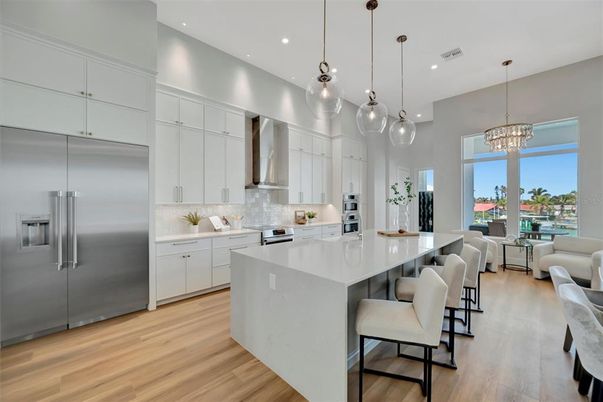 Chandelier, Interior, Kitchen, Living room, Pendant Lights, Recessed Lighting, Stainless Steel Appliances, Wood Texture Flooring