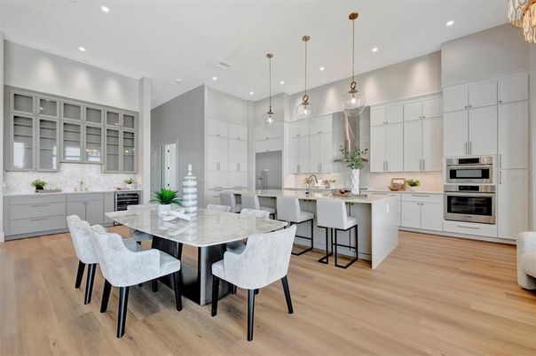 Dining room, Interior, Kitchen, Pendant Lights, Recessed Lighting, Stainless Steel Appliances, Wood Texture Flooring