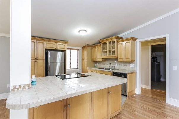 Interior, Kitchen, Tile Countertops, Wood Texture Flooring
