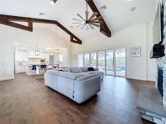 Chandelier, Fireplace, Interior, Kitchen, Living room, Pendant Lights, Recessed Lighting, Wooden Beams, Wood Texture Flooring