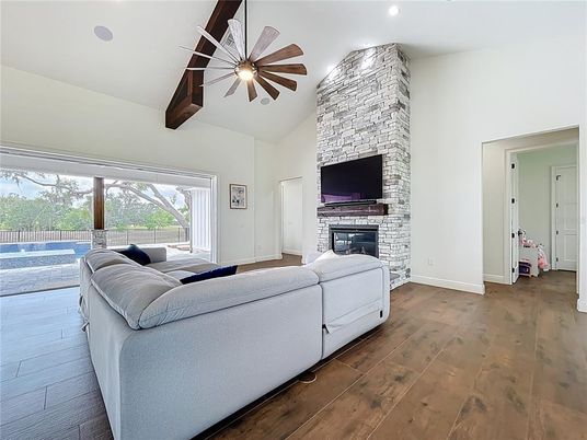 Bedroom, Fireplace, Interior, Recessed Lighting, Stone Walls, Wood Texture Flooring