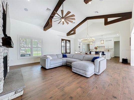 Chandelier, Fireplace, Interior, Kitchen, Living room, Pendant Lights, Recessed Lighting, Wooden Beams, Wood Texture Flooring