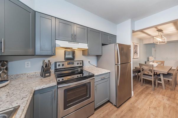 Dining room, Interior, Kitchen, Pendant Lights, Stainless Steel Appliances, Wood Texture Flooring