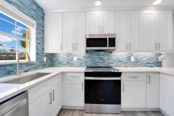 Interior, Kitchen, Recessed Lighting, Stainless Steel Appliances, Wood Texture Flooring