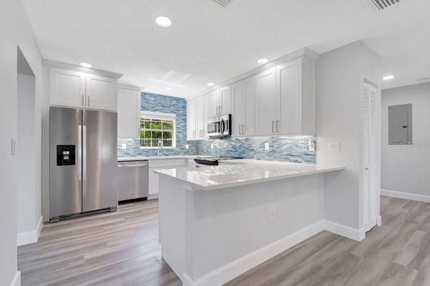 Interior, Kitchen, Recessed Lighting, Stainless Steel Appliances, Wood Texture Flooring