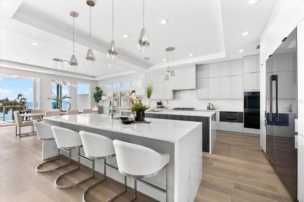 Dining room, Interior, Kitchen, Pendant Lights, Recessed Lighting, Stainless Steel Appliances, Water, Wood Texture Flooring
