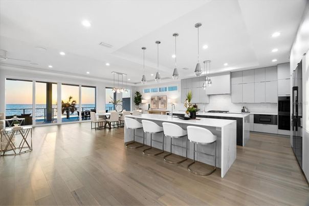 Dining room, Interior, Kitchen, Pendant Lights, Recessed Lighting, Stainless Steel Appliances, Water, Wood Texture Flooring