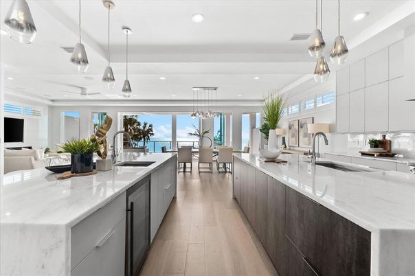 Dining room, Interior, Kitchen, Living room, Pendant Lights, Recessed Lighting, Stainless Steel Appliances, Water, Wood Texture Flooring