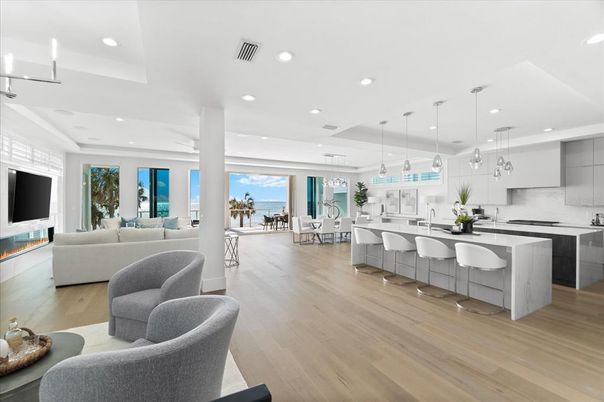 Dining room, Fireplace, Interior, Kitchen, Living room, Pendant Lights, Recessed Lighting, Stainless Steel Appliances, Water, Wood Texture Flooring