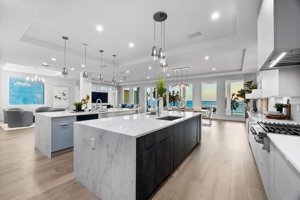 Chandelier, Dining room, Interior, Kitchen, Living room, Pendant Lights, Recessed Lighting, Stainless Steel Appliances, Water, Wood Texture Flooring
