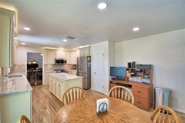 Dining room, Interior, Kitchen, Recessed Lighting, Stainless Steel Appliances, Wood Texture Flooring