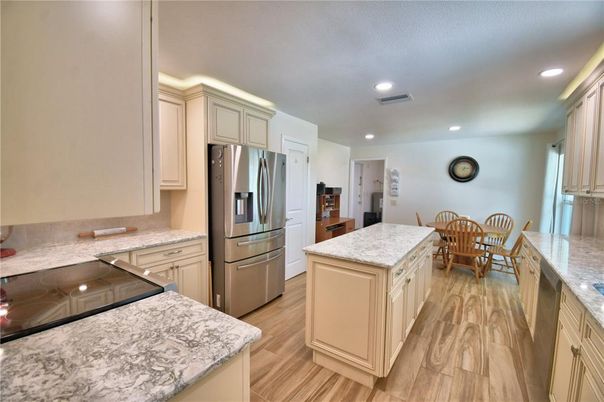 Dining room, Interior, Kitchen, Recessed Lighting, Stainless Steel Appliances, Wood Texture Flooring