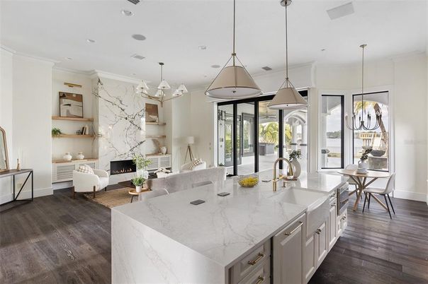 Dining room, Fireplace, Interior, Kitchen, Living room, Marble Walls, Pendant Lights, Recessed Lighting, Wood Texture Flooring