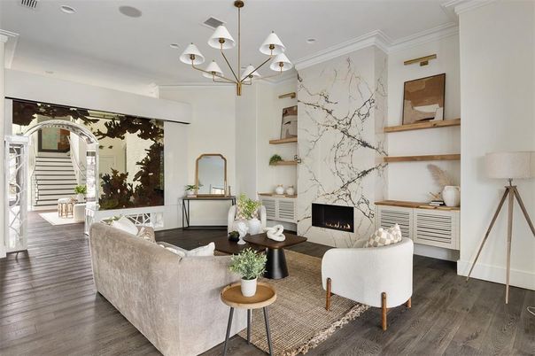 Chandelier, Fireplace, Interior, Living room, Marble Walls, Recessed Lighting, Wood Texture Flooring
