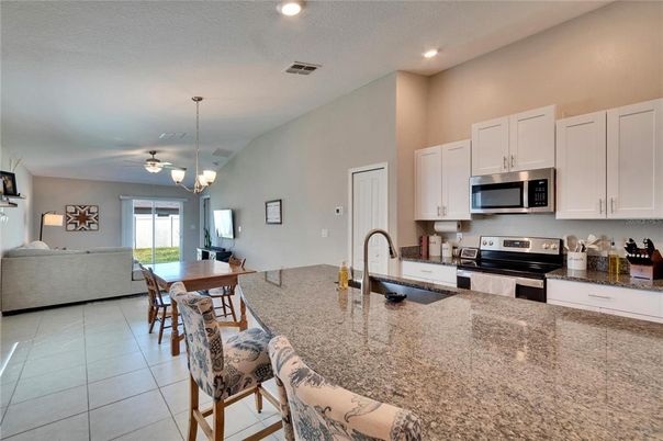 Chandelier, Dining room, Interior, Kitchen, Living room, Recessed Lighting, Stainless Steel Appliances