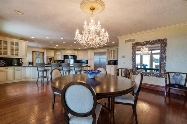 Chandelier, Dining room, Interior, Kitchen, Recessed Lighting, Stainless Steel Appliances, Wood Texture Flooring